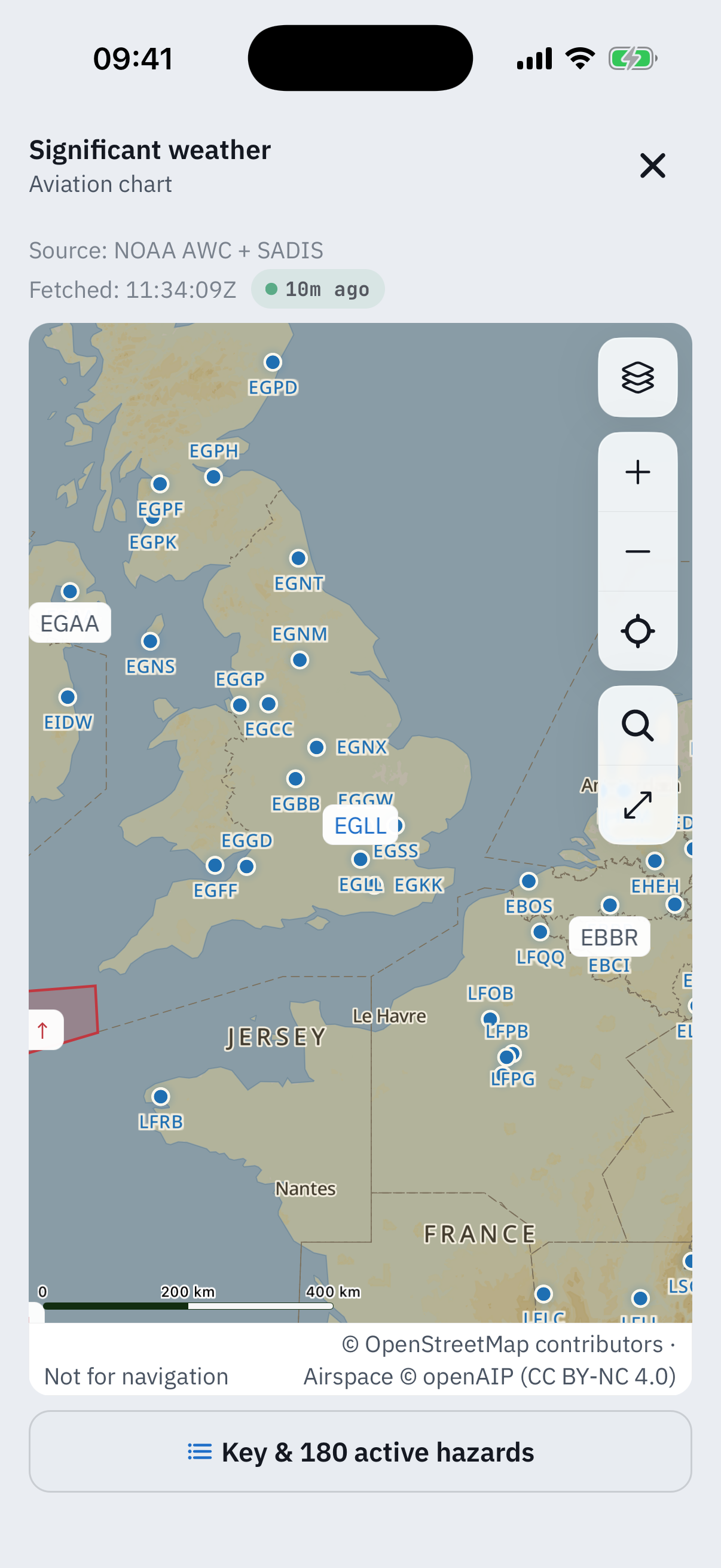 The full-screen significant weather chart over the UK and northern France: blue airport dots with ICAO labels from EGPD down to LFRB, a red SIGMET polygon off the Cornish coast with a hazard marker, the rail with layers, zoom, recenter, search and ruler buttons, the source line NOAA AWC plus SADIS fetched 11:17Z with a freshness pill, the Not for navigation and credits band, and the Key and 216 active hazards pill at the foot