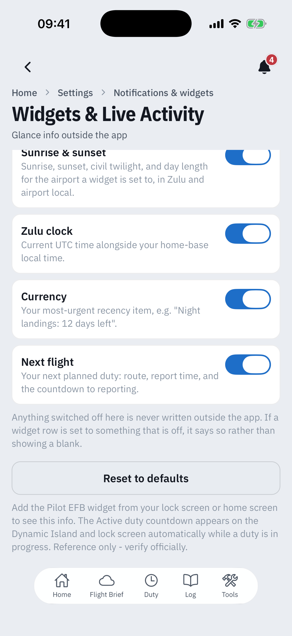 The foot of the Widgets and Live Activity screen: Sunrise and sunset, Zulu clock, Currency and Next flight toggles all on, a caption that anything switched off is never written outside the app, a Reset to defaults button, and the closing note that the Active duty countdown appears automatically while a duty is in progress, ending Reference only, verify officially