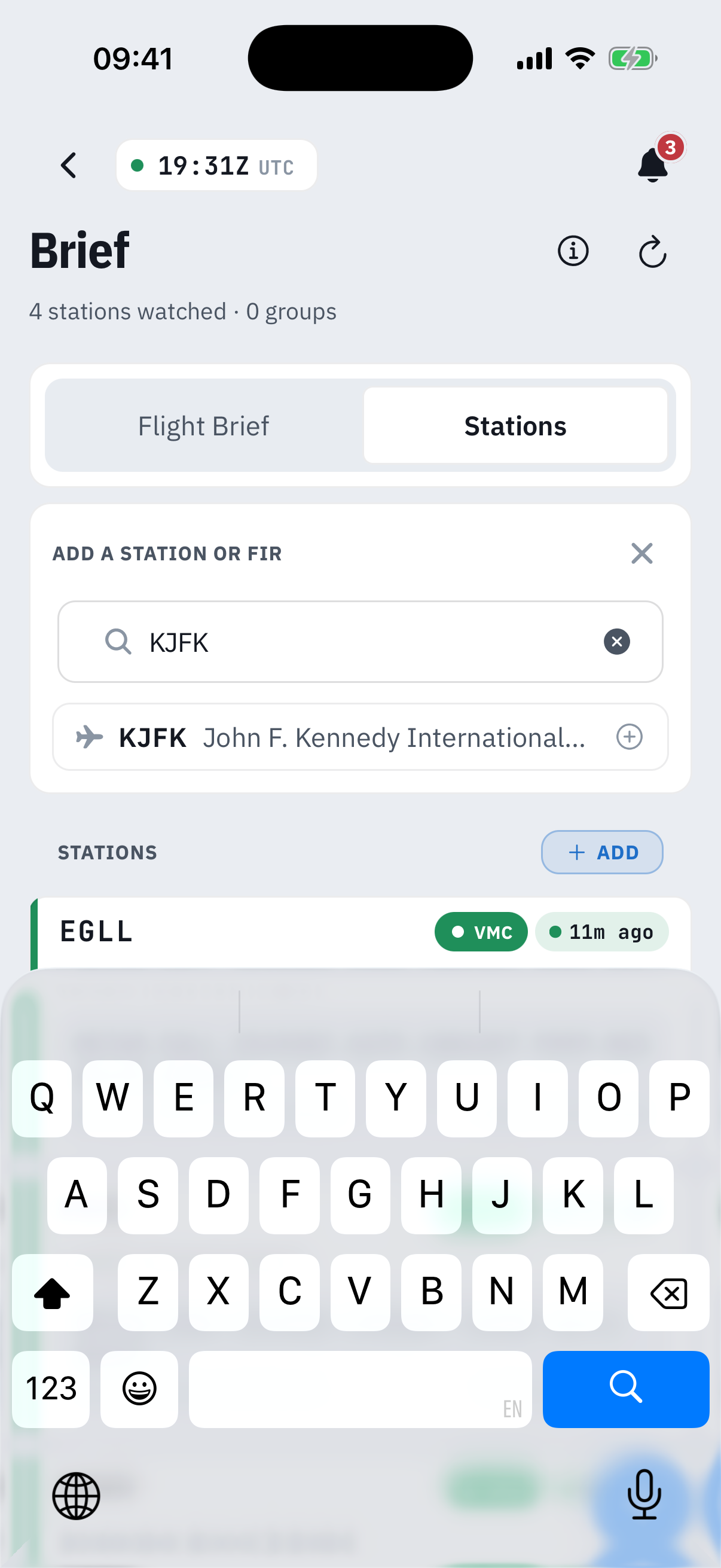 The add-station search with KJFK typed: a result row reading KJFK John F. Kennedy International with a plus icon, above the existing watch-list and the keyboard